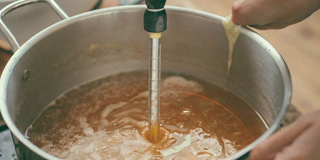 Batter THC melting into butter for cannabis edibles, ensuring proper THC activation for potent homemade recipes.