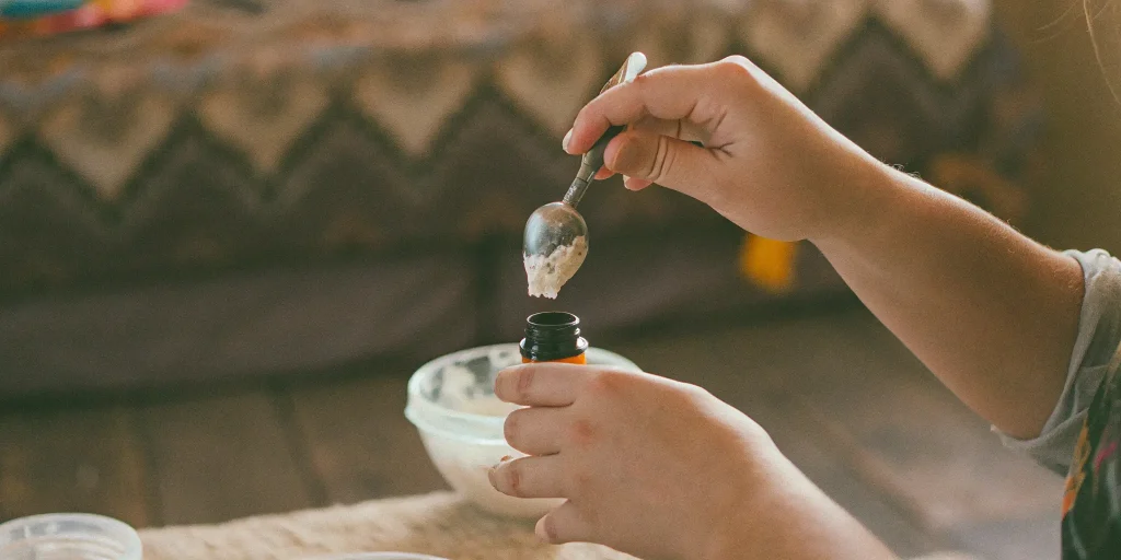 Scooping Batter THC with a dab tool, highlighting its smooth consistency and ease of use for dabbing sessions.